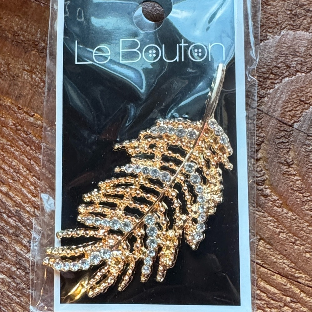 Gold Leaf Brooch by Le Bouton with dainty random costume crystal inserts.